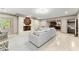 Open-concept basement with a fireplace, comfortable seating, and ample lighting at 311 Rolling Rock Se Rd, Marietta, GA 30067