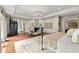 Luxurious main bedroom features hardwood floors, fireplace and sitting area with abundant natural light at 311 Rolling Rock Se Rd, Marietta, GA 30067