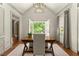 Bright home office with built-ins features hardwood floors and a serene view at 311 Rolling Rock Se Rd, Marietta, GA 30067