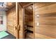 Dry Sauna with wood benches and wood paneled walls is perfect for relaxing after a workout at 311 Rolling Rock Se Rd, Marietta, GA 30067