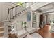 Open staircase with wrought iron railing and windows that provide ample natural light at 311 Rolling Rock Se Rd, Marietta, GA 30067