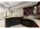 Wet bar with granite counters, tile backsplash, and wine storage is perfect for entertaining guests at 311 Rolling Rock Se Rd, Marietta, GA 30067