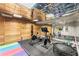 Home gym offers mirrored walls, a mirrored ceiling, and wood paneled walls and sauna at 311 Rolling Rock Se Rd, Marietta, GA 30067