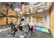 Home gym with exercise equipment, mirrored ceiling and walls, and wood paneled walls at 311 Rolling Rock Se Rd, Marietta, GA 30067
