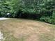 A natural partially shaded backyard provides a private outdoor area at 519 Granite Nw Ct, Lawrenceville, GA 30044