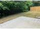 A concrete patio extends to a grassy area bordered by a new wooden fence at 519 Granite Nw Ct, Lawrenceville, GA 30044
