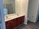 Bathroom features a double sink vanity, framed mirrors, and a toilet area for added privacy at 519 Granite Nw Ct, Lawrenceville, GA 30044