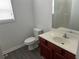 Bathroom featuring vanity, toilet, and window at 519 Granite Nw Ct, Lawrenceville, GA 30044