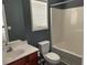 Bathroom featuring a dark blue accent wall, shower and bath at 519 Granite Nw Ct, Lawrenceville, GA 30044