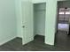 Bright bedroom with closet and open door to garage at 519 Granite Nw Ct, Lawrenceville, GA 30044