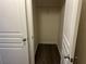 Hallway closet with a single shelf, providing simple and functional storage space at 519 Granite Nw Ct, Lawrenceville, GA 30044