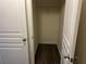 A walk-in closet with dark wood laminate flooring at 519 Granite Nw Ct, Lawrenceville, GA 30044