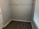 This is a closet with wood laminate flooring at 519 Granite Nw Ct, Lawrenceville, GA 30044