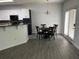 Cozy dining area with gray floors, a round table, and sliding glass doors at 519 Granite Nw Ct, Lawrenceville, GA 30044