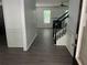 Inviting entryway with modern gray floors, white walls, and a view into the living room at 519 Granite Nw Ct, Lawrenceville, GA 30044