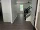 Inviting foyer with stylish gray wood-look flooring and a staircase leading to the upper level at 519 Granite Nw Ct, Lawrenceville, GA 30044