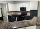 Well-appointed kitchen with granite countertops, stainless steel appliances, and ample cabinet space at 519 Granite Nw Ct, Lawrenceville, GA 30044
