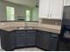 Modern kitchen featuring granite countertops, stainless steel appliances, and gray flooring at 519 Granite Nw Ct, Lawrenceville, GA 30044