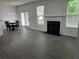 Spacious living room featuring a fireplace, dining area, and natural light at 519 Granite Nw Ct, Lawrenceville, GA 30044