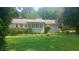 Spacious backyard featuring a lush lawn and mature trees at 61 Maxie Ln, Dallas, GA 30157