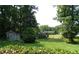 Expansive backyard with a shed and playground, surrounded by trees at 61 Maxie Ln, Dallas, GA 30157