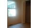 Bright bedroom featuring a large window and closet space at 61 Maxie Ln, Dallas, GA 30157