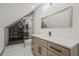 A modern bathroom features a glass shower, a light wood vanity, and unique tile at 2809 Glenwood Se Ave, Atlanta, GA 30317