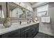 Modern bathroom featuring double vanity, framed mirrors, and sleek black fixtures at 2809 Glenwood Se Ave, Atlanta, GA 30317
