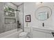 Modern bathroom features a tub, shower, vanity, and large framed mirror at 2809 Glenwood Se Ave, Atlanta, GA 30317