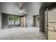 A spacious bedroom with plush carpet, a ceiling fan, and multiple windows with natural light at 2809 Glenwood Se Ave, Atlanta, GA 30317