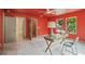 A bright bedroom features an eye-catching paint color, and multiple doorways at 2809 Glenwood Se Ave, Atlanta, GA 30317