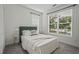 Bright bedroom with large window, plush carpet, and neutral decor at 2809 Glenwood Se Ave, Atlanta, GA 30317