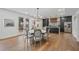 Open-concept dining area featuring a view of the backyard through glass doors, adjacent to the kitchen at 2809 Glenwood Se Ave, Atlanta, GA 30317