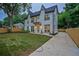 A two-story modern farmhouse with stylish exterior lighting and freshly installed driveway at 2809 Glenwood Se Ave, Atlanta, GA 30317