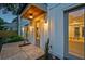 Exterior shows covered entryway with stained wood and a manicured garden at 2809 Glenwood Se Ave, Atlanta, GA 30317