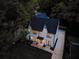 Aerial view shows the home's dark roof, long driveway, and beautiful wooded surroundings at 2809 Glenwood Se Ave, Atlanta, GA 30317