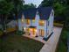 Beautiful two-story home with a dark roof, manicured lawn, and freshly poured driveway at 2809 Glenwood Se Ave, Atlanta, GA 30317