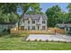 Newly built two-story home boasting a well-kept lawn, modern fence and parking pad at 2809 Glenwood Se Ave, Atlanta, GA 30317