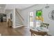 Hallway with a modern staircase and view of the backyard through a glass door at 2809 Glenwood Se Ave, Atlanta, GA 30317