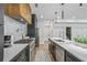 Bright kitchen with white countertops, stainless steel appliances, and modern fixtures at 2809 Glenwood Se Ave, Atlanta, GA 30317
