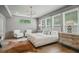 Serene main bedroom with a neutral color palette, large windows, and stylish decor at 2809 Glenwood Se Ave, Atlanta, GA 30317