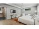 Comfortable main bedroom with contemporary design, hardwood floors, and a view of the en-suite bathroom at 2809 Glenwood Se Ave, Atlanta, GA 30317
