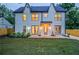 A modern home featuring a rear exterior with a well-maintained lawn and a gray trim at 2809 Glenwood Se Ave, Atlanta, GA 30317