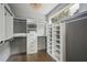 Spacious walk-in closet with custom shelving, natural light, and wood flooring at 2809 Glenwood Se Ave, Atlanta, GA 30317