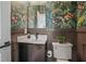 Powder room features patterned wallpaper, dark wood accents, and a vessel sink at 2809 Glenwood Se Ave, Atlanta, GA 30317