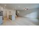 Spacious open concept living area with wood-look flooring, recessed lighting and a ceiling fan at 321 Heavenly Hollow Pl, Mcdonough, GA 30253