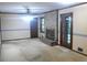 Cozy living room features a brick fireplace, ceiling fan, and an exit to the backyard at 4747 Darlene Way, Tucker, GA 30084