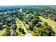 An aerial view of beautiful homes lining a golf course in a quiet, wooded neighborhood at 160 Isleworth Way, Fayetteville, GA 30215