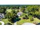 Aerial view of a beautiful house surrounded by mature trees and lush greenery at 160 Isleworth Way, Fayetteville, GA 30215