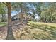 Spacious backyard offers plenty of room for outdoor enjoyment, including lounge chairs and an outdoor dining table at 160 Isleworth Way, Fayetteville, GA 30215